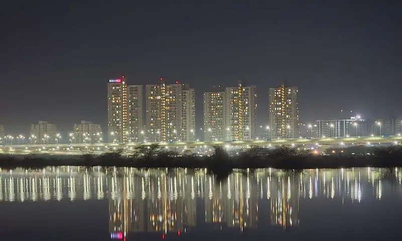 Gurugram skyline reflected in water at night